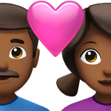 Coppia con cuore - Uomo: carnagione medio-scura, Donna: carnagione medio-scura per Apple iOS 18.4