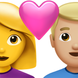 Pár se srdcem – žena: žádný tón pleti, muž: středně světlý tón pleti pro Apple iOS 18.4