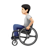 Osoba na wózku inwalidzkim: karnacja jasna dla Apple iOS 18.4