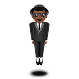 Osoba v obleku levituje: Středně tmavý odstín pleti pro Apple iOS 18.4