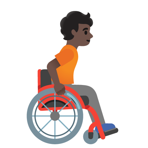 Osoba na ručním invalidním vozíku otočená doprava: tmavý odstín pleti pro Google 16.0
